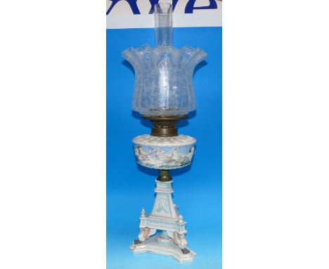 A 19th century Dresden style oil lamp on trefoil base, with etched shade and classical decoration (some loss to finials)