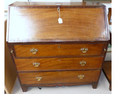 A Georgian crossbanded mahogany fall front bureau with fitted interior, 3 long drawers with later brass handles, and bracket 