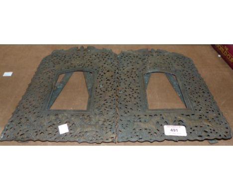 A pair of 19th century embossed and pierced brass Indian easel photo frames, height 12"