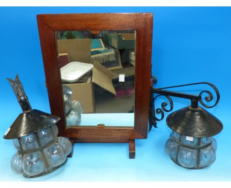 A pair of wrought iron bracket lamps; a dressing table mirror