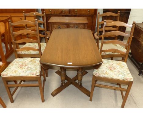 A modern Ercol light elm dining suite comprising oval drop leaf table and 4 (2 + 2) ladder back chairs