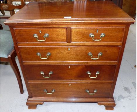 A Georgian style mahogany bachelor's chest of 2 short and 3 long drawers with brass swan neck handles, on bracket feet