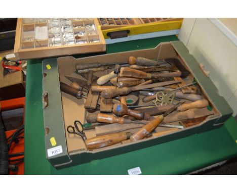 A box of various hand tools
