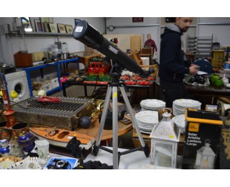 A Draper telescope on tripod stand.
