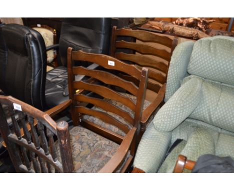 A pair of ladder back carver chairs