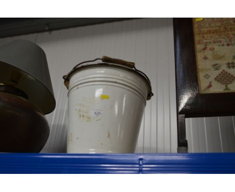 An enamel pail and lid