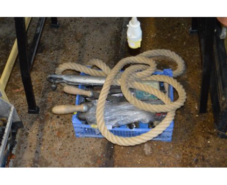 A plastic tray of various hand tools and a rope