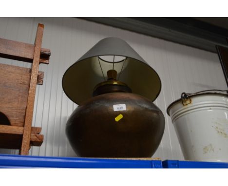 A copper table lamp and shade lacking lead
