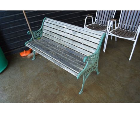A wooden and metal garden bench