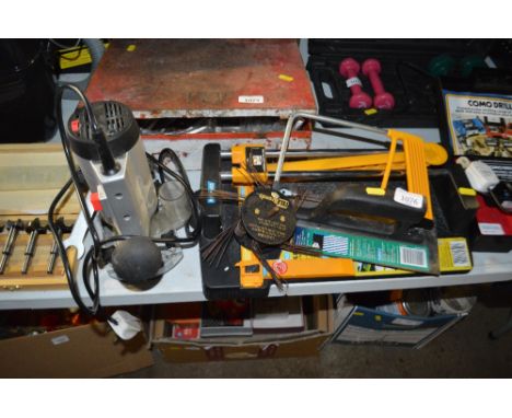 A tile cutter; floor tile trowel etc 