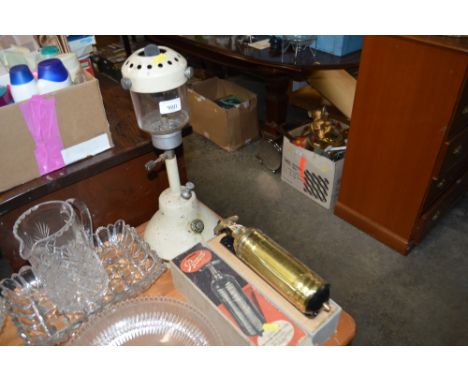 A paraffin lamp together with a brass fire extinguisher