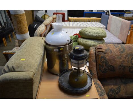 A Tilly lamp together with a silver plated tray raised on paw feet, oil lamp with milk bar shade