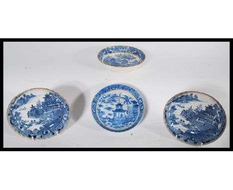 A group of four early English Factory most likely Worcester blue and white bowls / plates to include a pair depicting temples