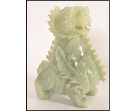 An unusual large Chinese Jade fu dog - temple dog inkwell pot sculpture. The large carved model with shaggy mane and brest in