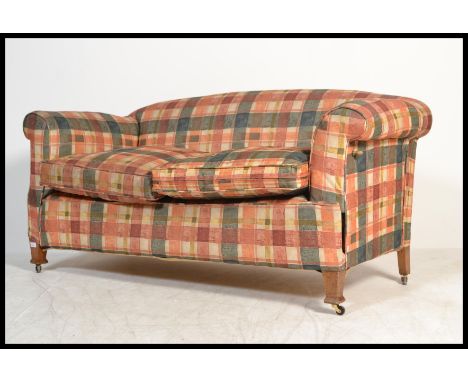 An  Edwardian drop arm sofa / daybed on square tapered legs to brass caps and castors, with a later upholstery chequered fabr