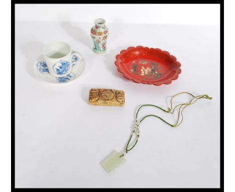 A dealers lot of Chinese items to include a 19th century Kangxi period tea cup and saucer, a papier mache lacquered dish, soa