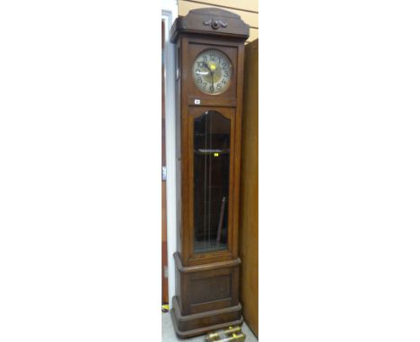 MID-TWENTIETH CENTURY OAK LONGCASE CLOCK with circular dial, brass centre plate