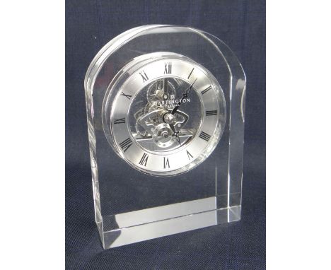 MODERN BOXED DARTINGTON CRYSTAL GLASS ENCASED MANTEL CLOCK with skeleton movement and silver chapter dial bearing Roman numer