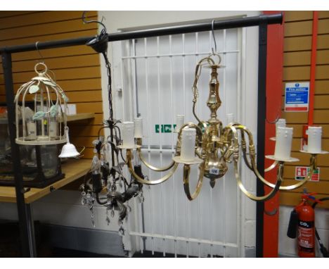 AN EIGHT ARM BRASS CEILING LIGHT together with two other leaf decorated ceiling lights