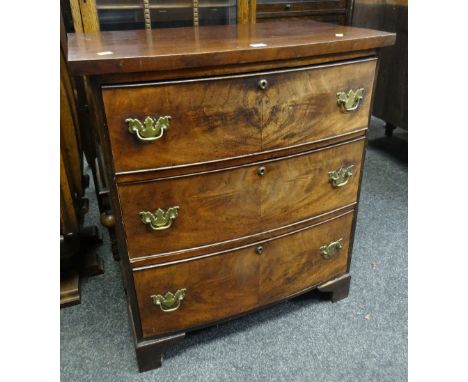 ANTIQUE MAHOGANY BOW FRONTED THREE DRAWER CHEST OF DRAWERS with brass fittings