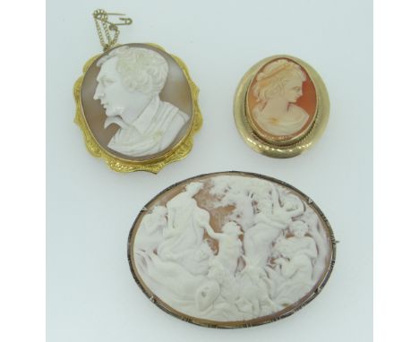 THREE ANTIQUE CAMEO BROOCHES to include an extensively carved mythological scene oval brooch with numerous figures in a white