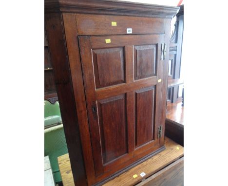 ANTIQUE OAK PANELLED HANGING CORNER CUPBOARD with three-shelf interior