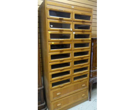 GOOD VINTAGE LIGHT OAK DRAPER'S CABINET fitted with sixteen glass fronted drawers to the top by Liddle, Keene &amp; Co Ltd, L