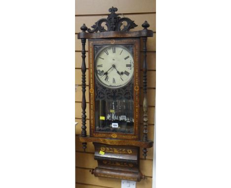 EARLY 20TH CENTURY INLAID AND FRETWORK DECORATED VIENNA STYLE CLOCK with scroll base and carved centre finial and mirror back