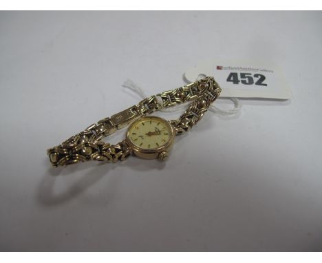 Rotary: A 9ct Gold Ladies Wristwatch, the signed dial with line markers, to openwork panel style bracelet.