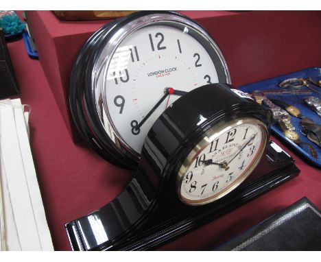 An Art Deco Style Modern Wall Clock, "London Clock", boxed; together with a vintage style black quartz mantel clock, boxed. (