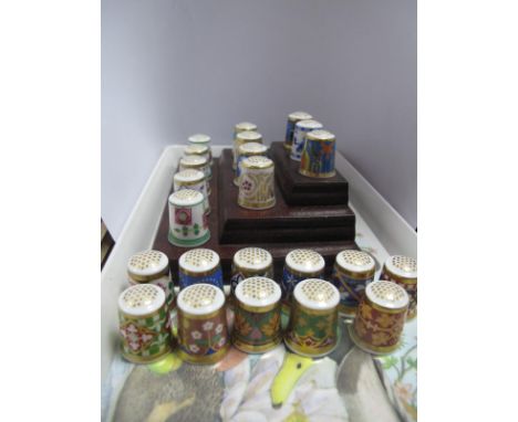 Twelve Minton Thimbles, on three tier stand and a further eleven.
