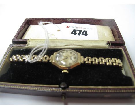 Tissot: A 9ct Gold Case Ladies Wristwatch, the signed dial with Arabic numerals and dagger markers, to integral gate style br
