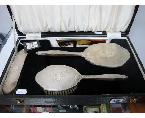 A "Broadway" Hallmarked Silver Backed Three Piece Dining Table Set, engine turned, in original fitted case with associated ha