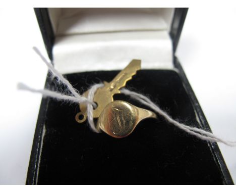 A 9ct Gold Signet Ring, oval panel initialled, to plain shoulders, a Chester hallmarked 9ct gold novelty key pendant/charm.