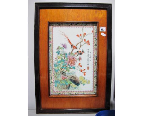 Oriental Ceramic Wall Plaque, featuring exotic birds, amongst foliage, within yellow floral border, approximately 36 x 23cm, 