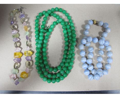 A Modern Long Single Strand Polished Jade Colour Bead Necklace, modern multi faceted bead necklace and another. (3)