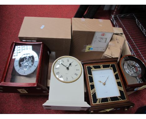 Three Modern Mantel Clocks, boxed; together with a "London Clock" cream quartz mantel clcok, boxed. (4)