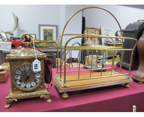 A Gilded Metal Cased Carriage Style Clock, having eight day movement, bell strike, black Roman numerals to white inset panels