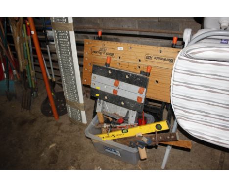 Two workmates together with a box of various hand tools