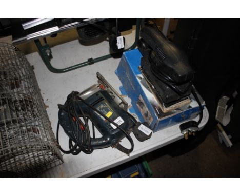 A Black &amp; Decker jig saw together with a Woolworths Workshop orbital sander