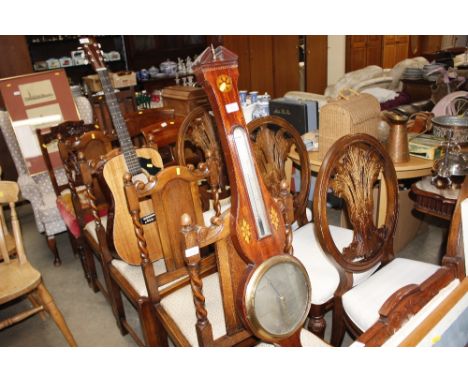 An antique mahogany barometer