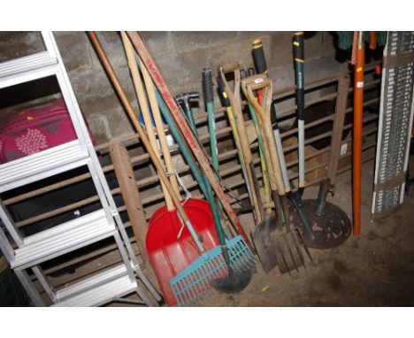 A quantity of long handled gardening tools