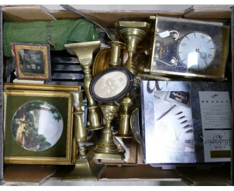 A mixed collection of metal ware items including brass candlesticks, similar anniversary clock, silver plated cutlery, early 