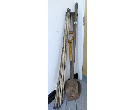 Gardening tools to include, a shovel, pitch fork, turf spade, Qualcast lawn mower and a selection of screw ended bamboo lengt