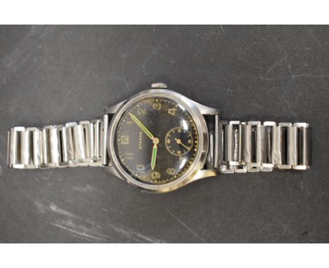 A WWII Eterna Jumbo military style gentlemans wristwatch, black dial with gold Arabic numerals, green hands, manual wind, 37m