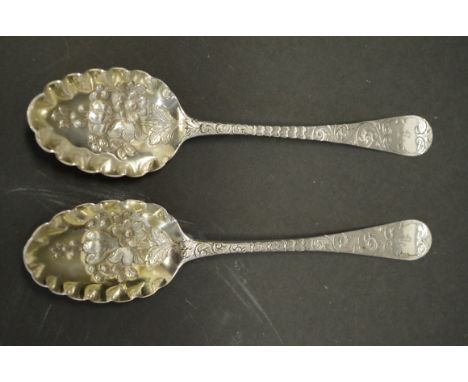 A Georgian silver gilt berry spoon, by Hester Bateman,&nbsp;London 1780; together with a similar example, London 1788, having