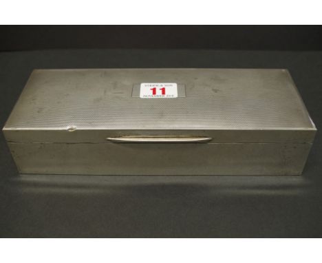 An engine turned rectangular silver cigarette box, by E &amp; N Speak, Birmingham 1953, 24.5cm x 9cm, 820g all in. 