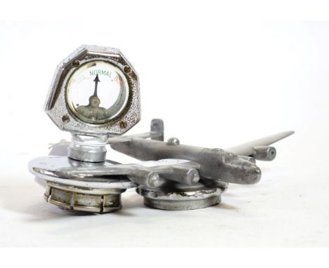 A 1930's Morris Car Mascot, as a Lancaster Bomber or Stirling Plane, mounted on a radiator cap, 14cm wide; and A Chromed Calo
