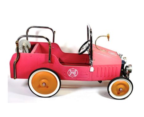 A Child's Metal Pedal Car, as a fire engine, with chromed tubular roll bar and radiator, the rear fitted with a revolving hos
