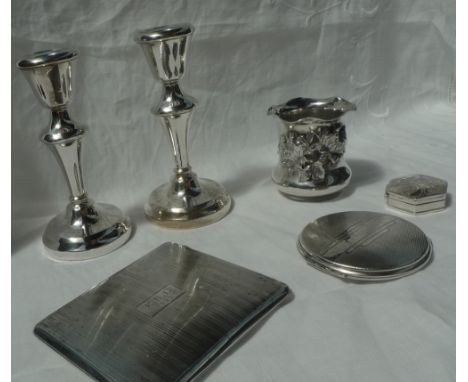 A pair of Elizabeth II silver desk candlesticks, Birmingham, 1959, 11.5cm high together with a silver cigarette case, silver 